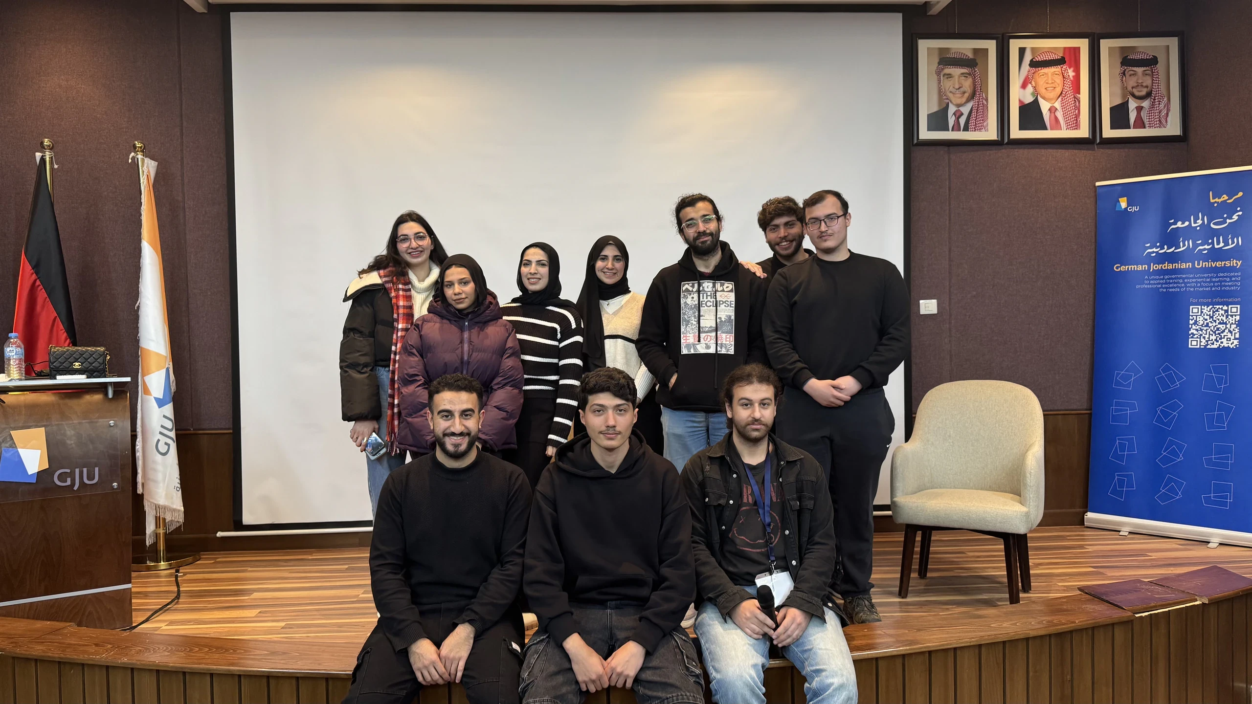 Students gathered for a group photograph in a university hall