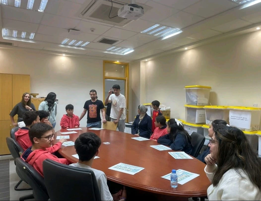 A group gathered around a conference table during an activity