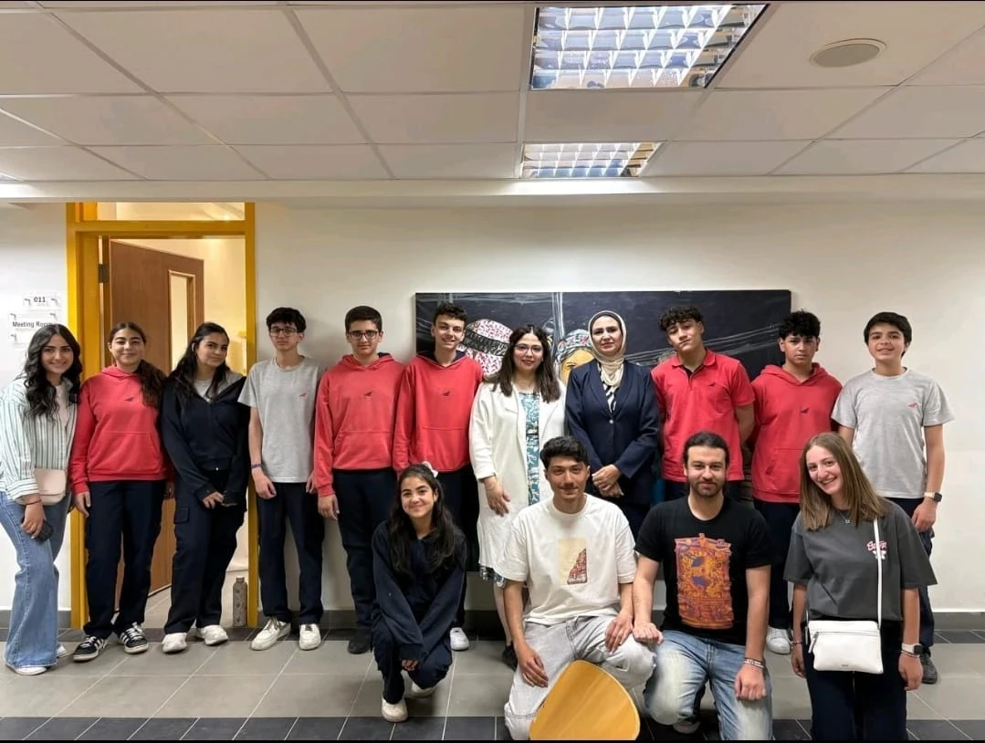 A group of participants standing together after an indoor activity